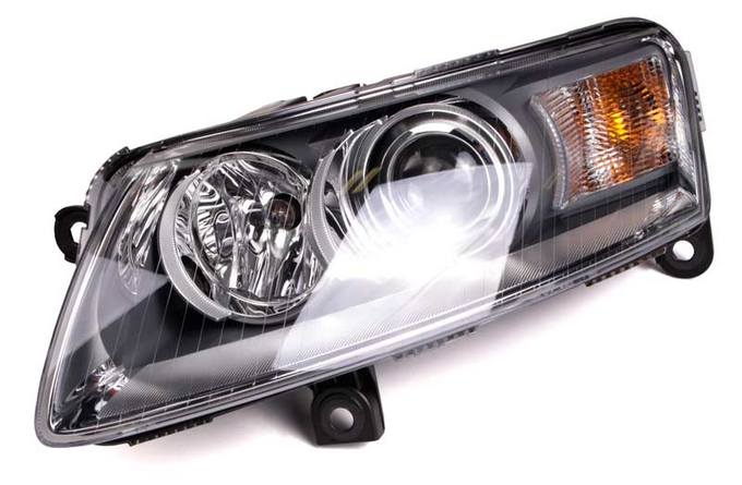 Audi Headlight Assembly - Driver Side (Xenon) 4F0941029EK - Hella 009701151